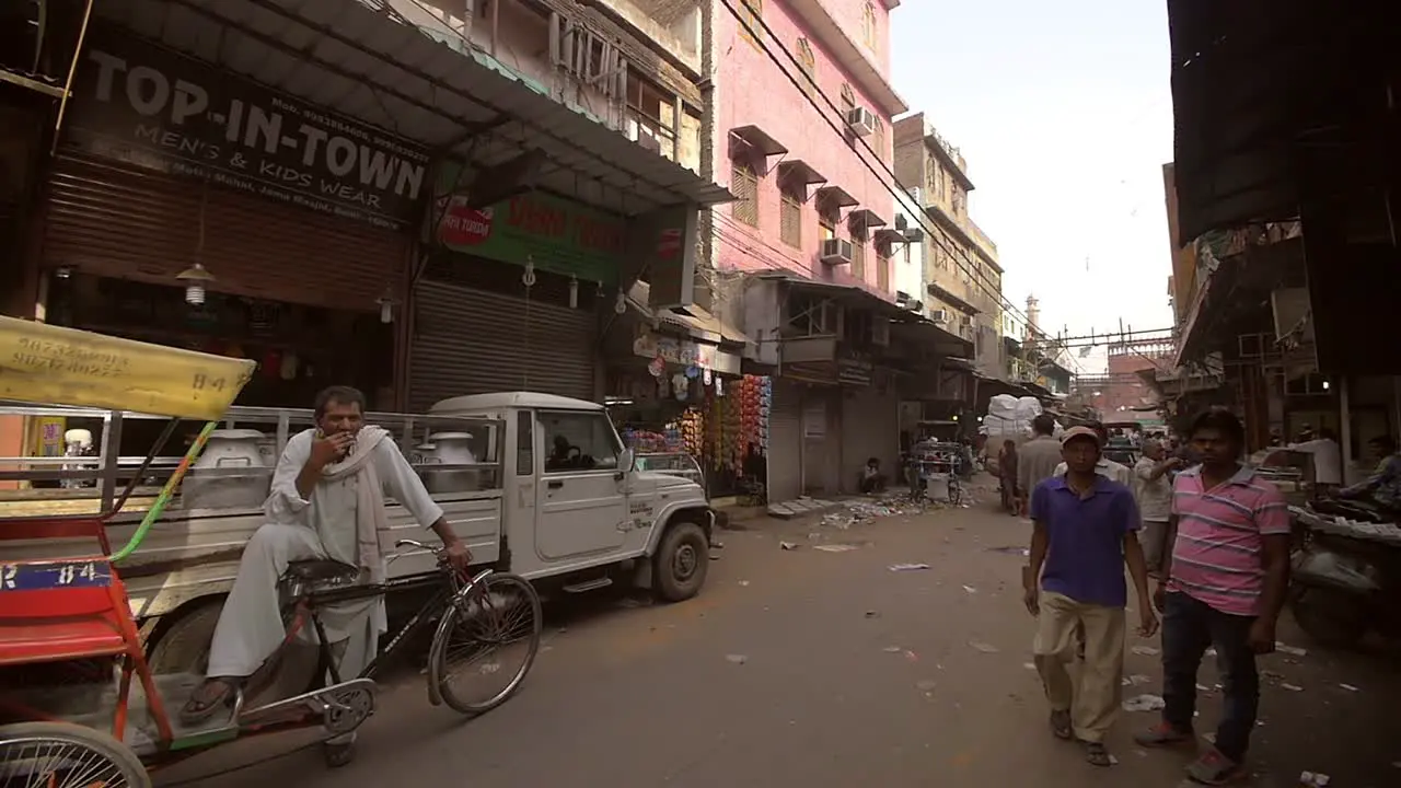 Panning Shot Revealing a Man Pulling a Cart