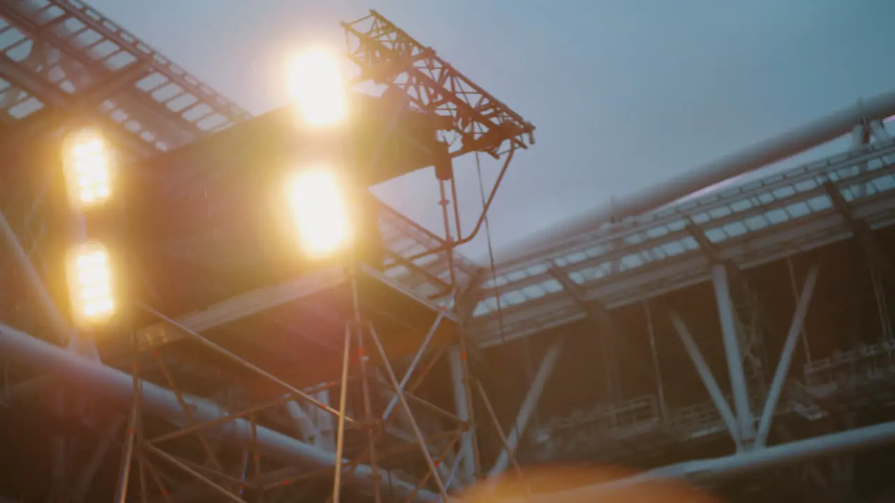 Turning on and off stage lights at the concert outdoor in the dusk