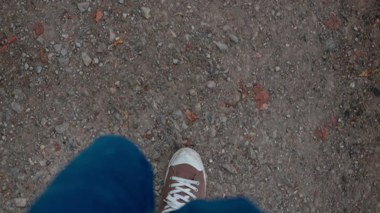 Top shot of walking along gravel path slow motion