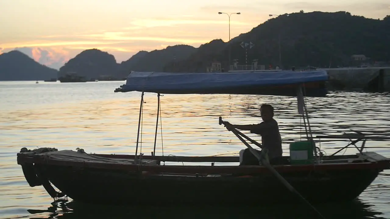 Traditional Vietnamese Boat on Ha Long Bay at Sunset