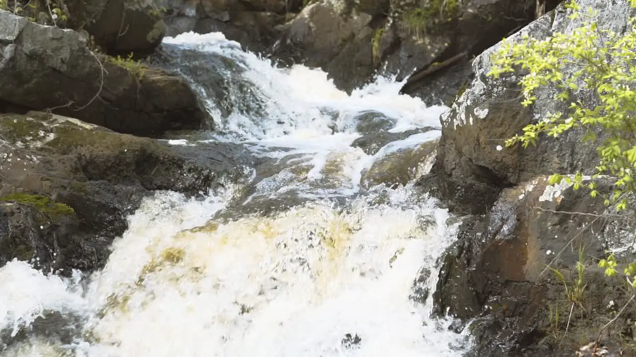 Slow motion small waterfall close up shot