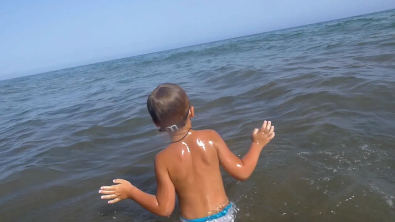 Child swimming in the sea