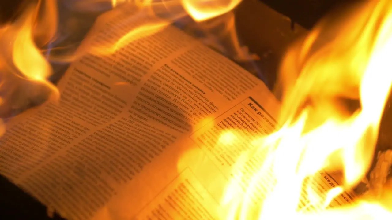 Newspaper in the flames of fire