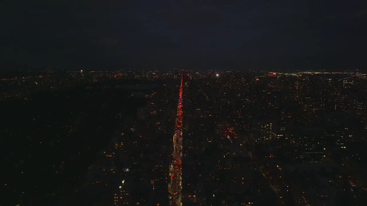 Aerial panoramic view of night City High angle view of transport thoroughfare leading through city Traffic on avenue Manhattan New York City USA