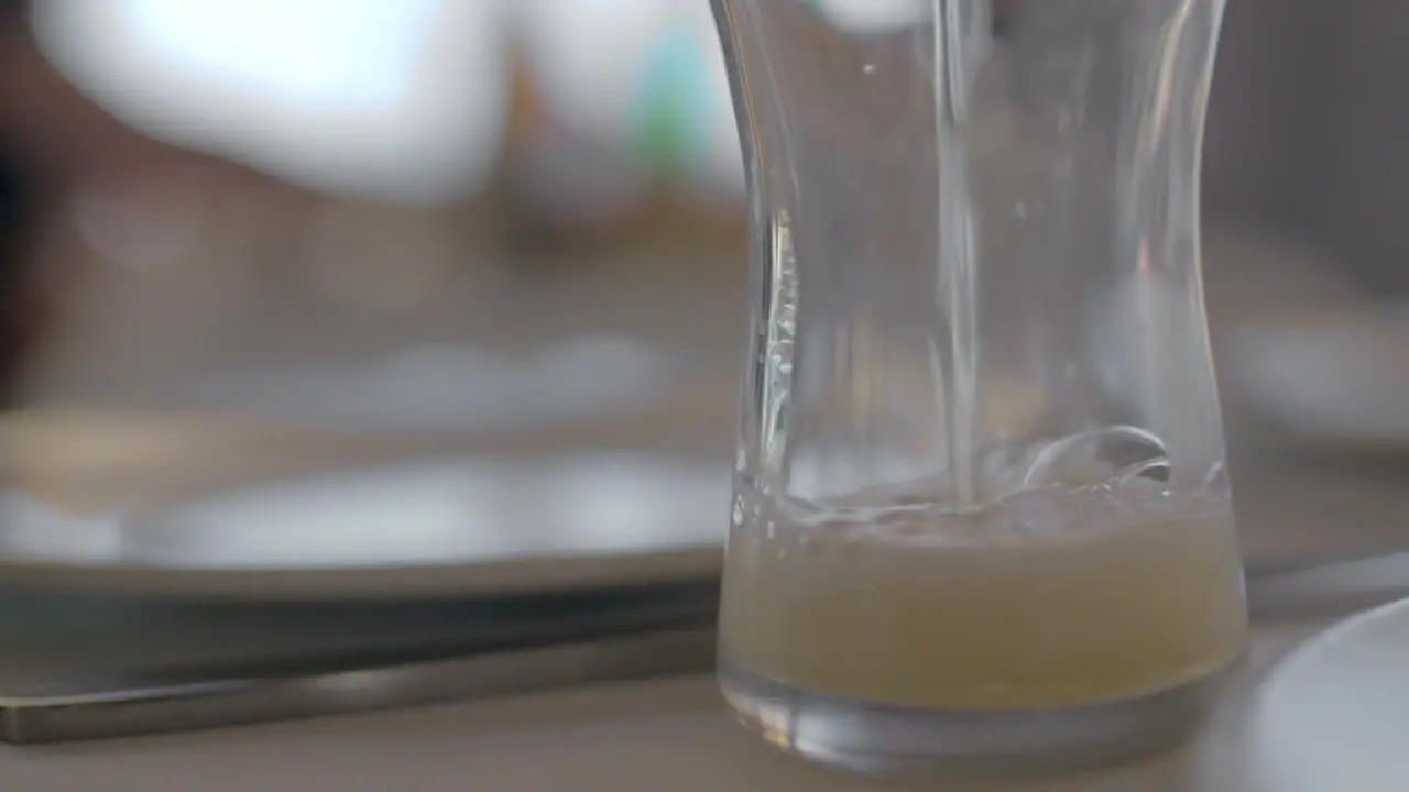 Pouring beer into the glass