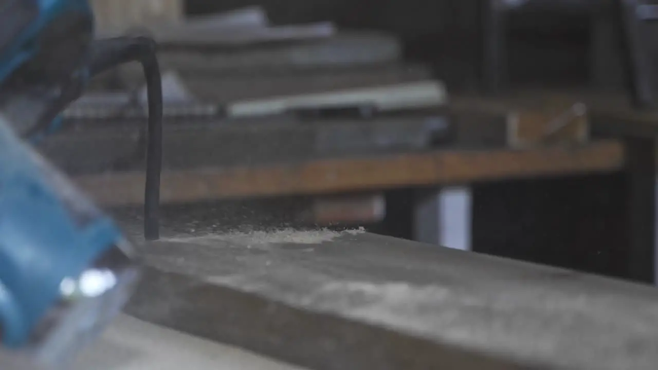 Workshop blowing dust wood woodworker slow motion