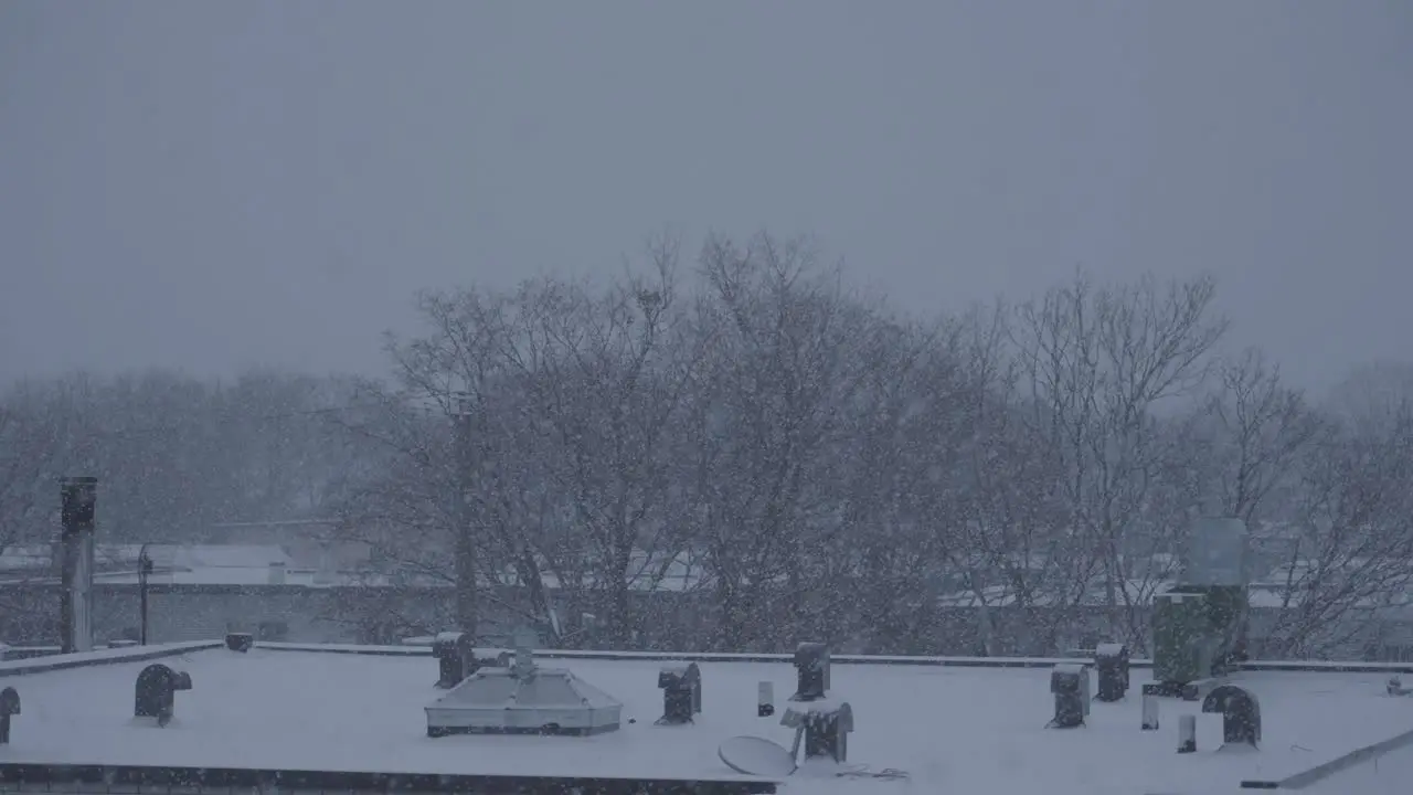 Winter Snow Falling in Slow Motion on City Building Roof in Slow Motion 120fps