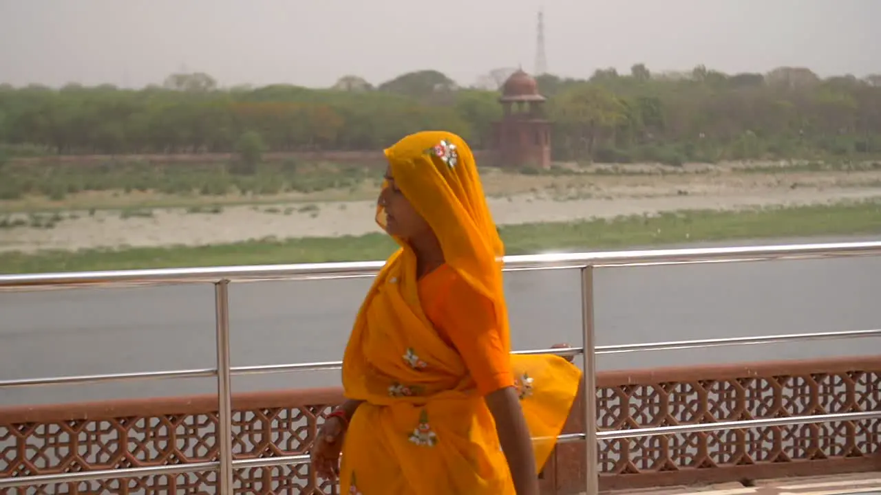 Slow Motion Shot of a Woman in an Orange Sari