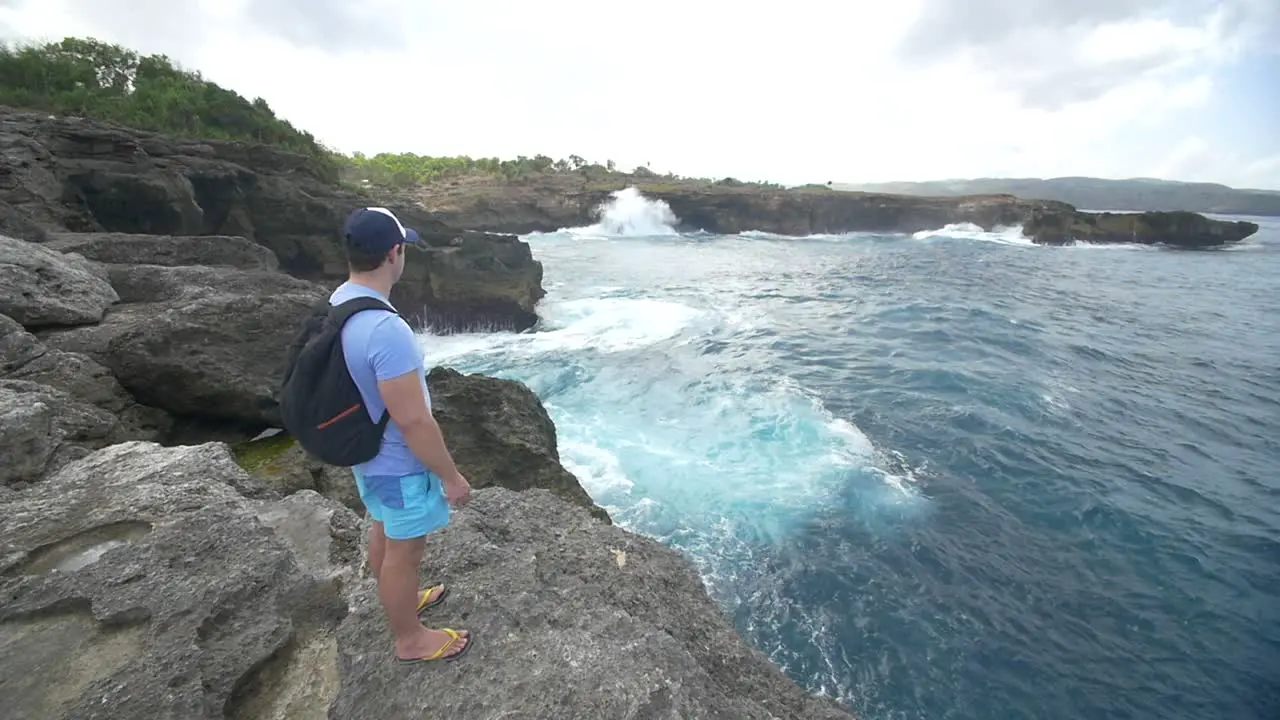 Tourist Overlooking Bali Coastline