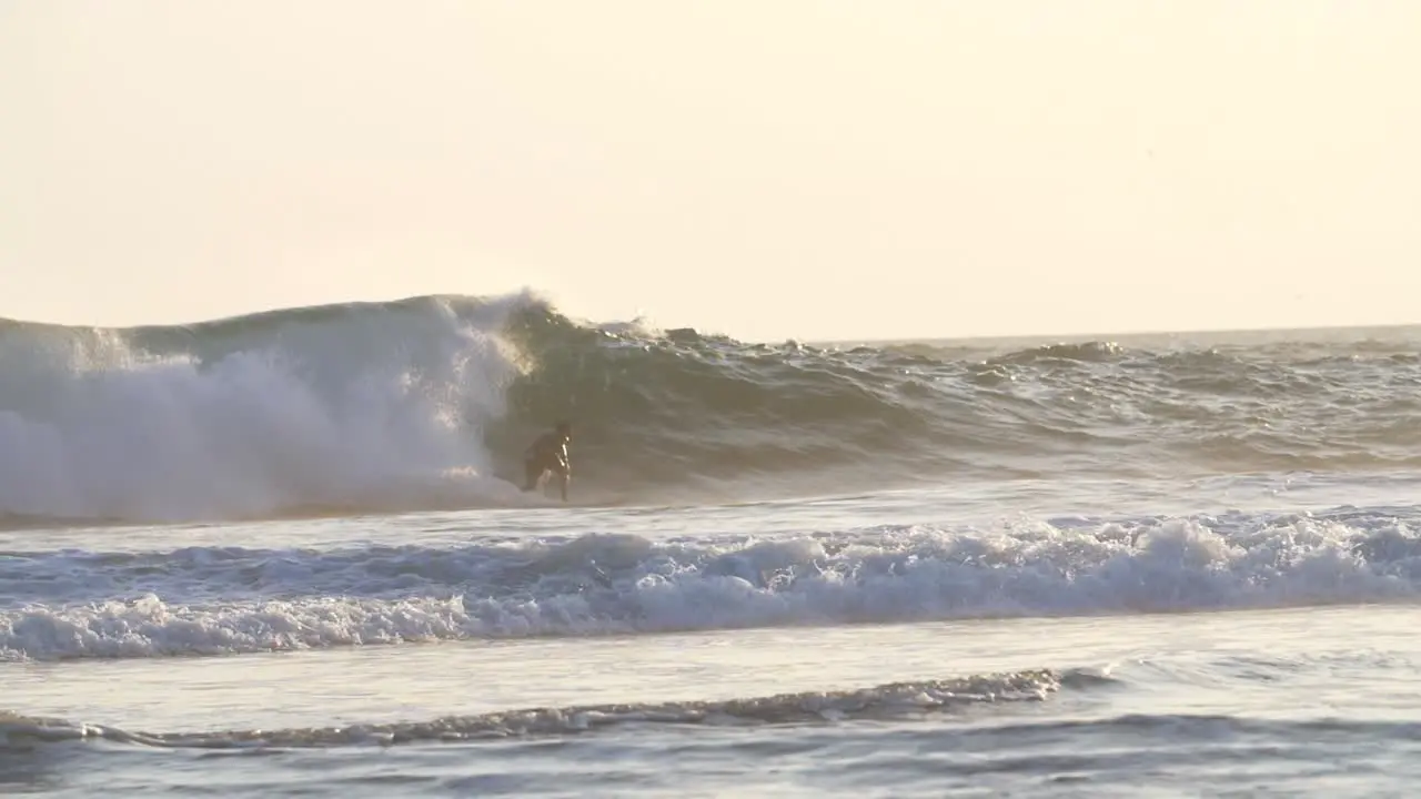 Slow Motion Shot of a Man Surfing