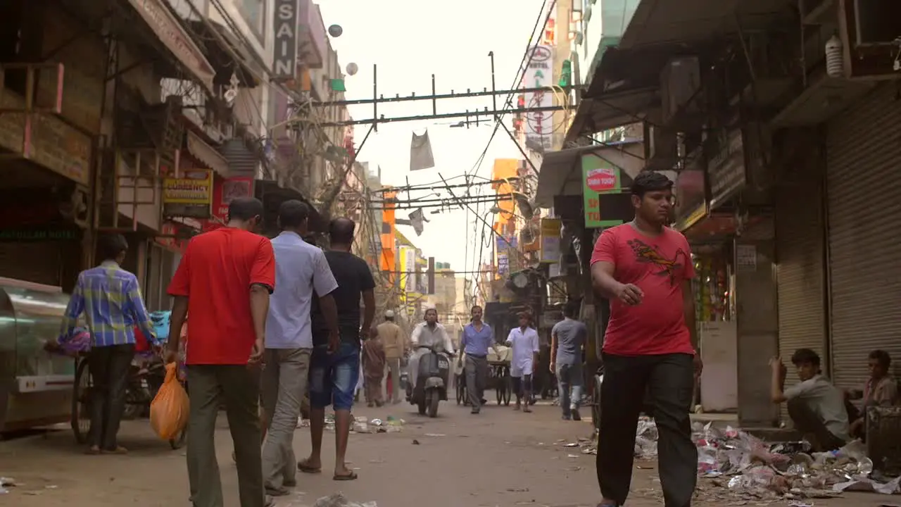 People Walking Down a Road in India