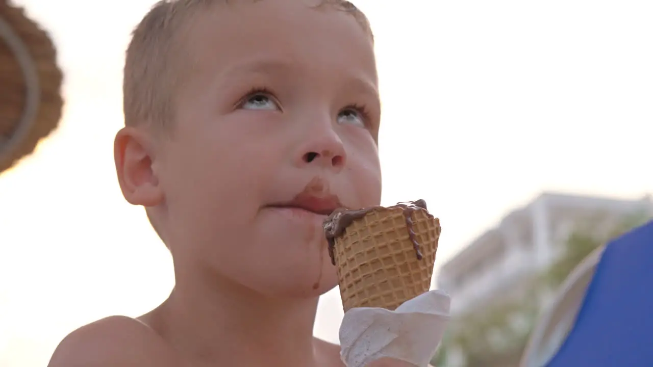 Kid enjoying chocolate ice cream outdoor