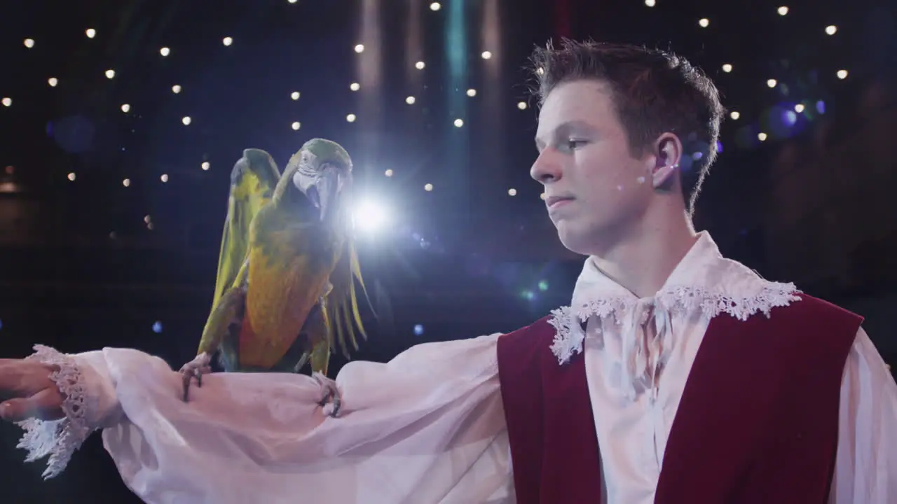 Circus tamer and his macaw