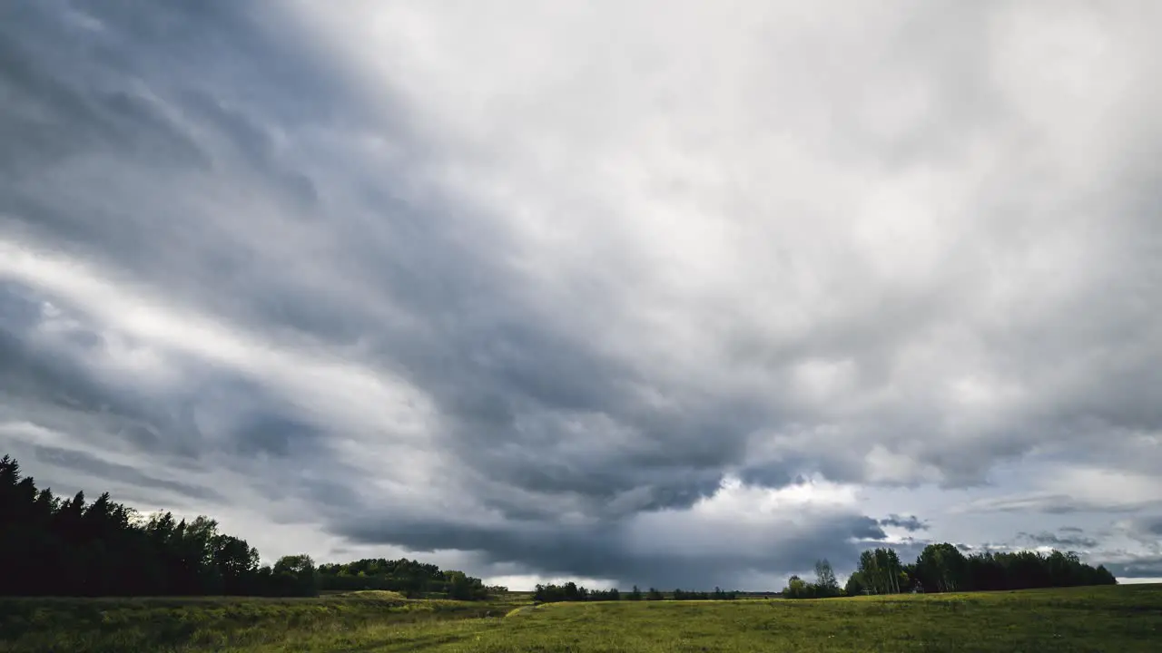 Time lapse footage of clouds moving above the fields