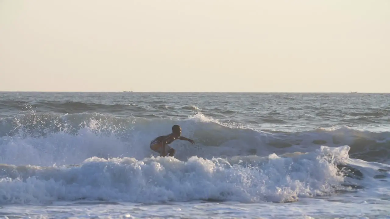 Tracking Shot of a Man Surfing in the Sea