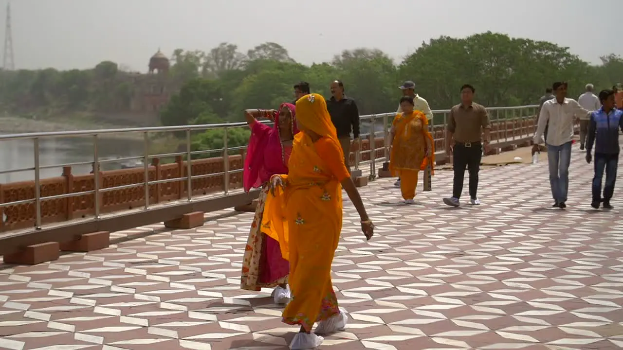 Slow Motion Shot of Two Women in Saris Walking