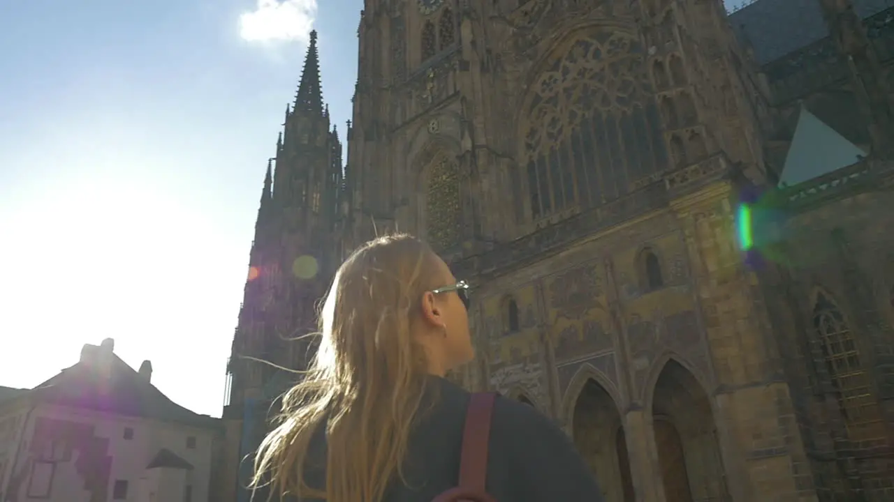 Slow motion view of woman watching on the Votive Church and then taking it picture Vienna Austria