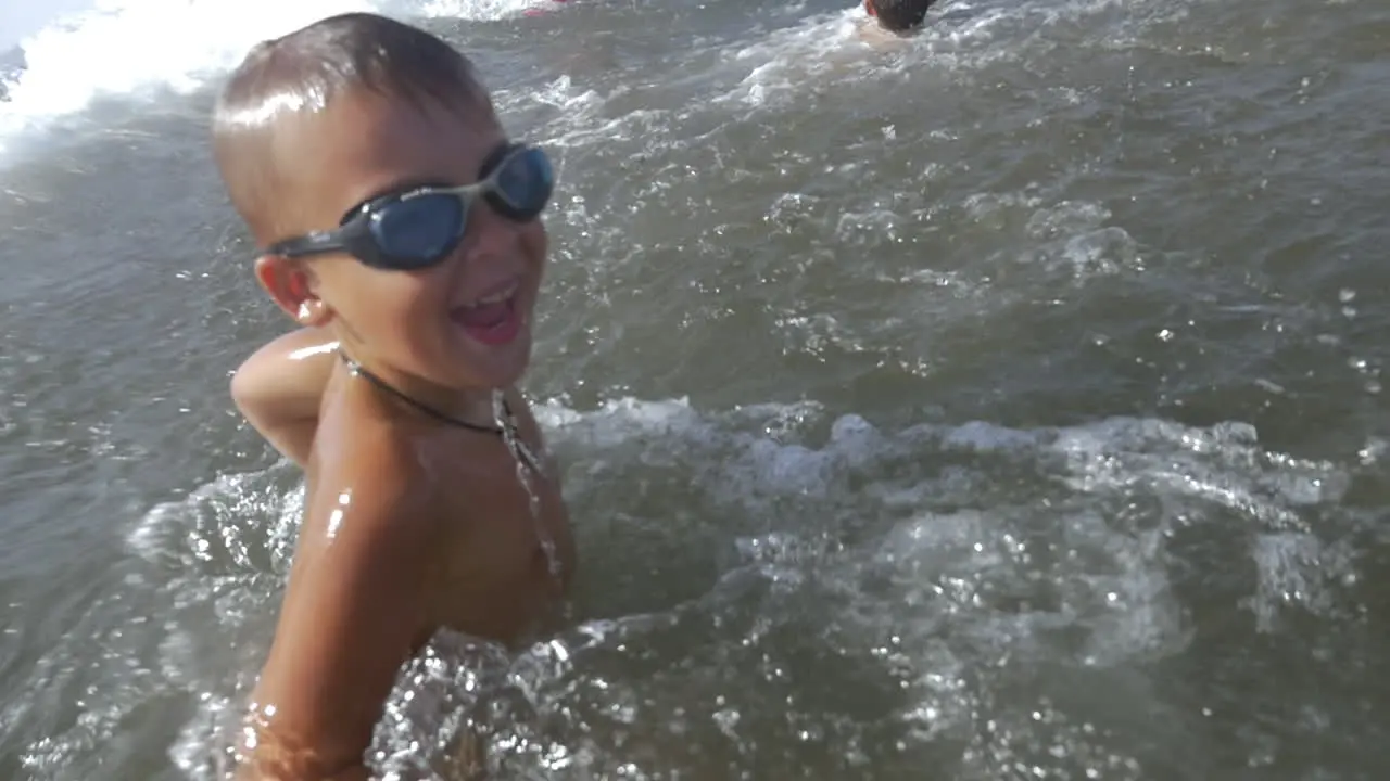 Child enjoying swimming in the sea