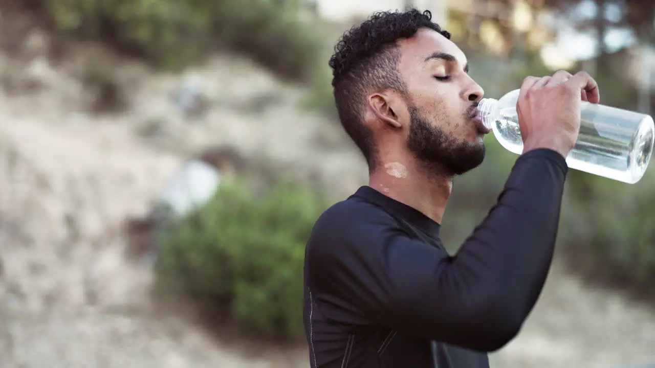 Man sweating or drinking water in fitness break