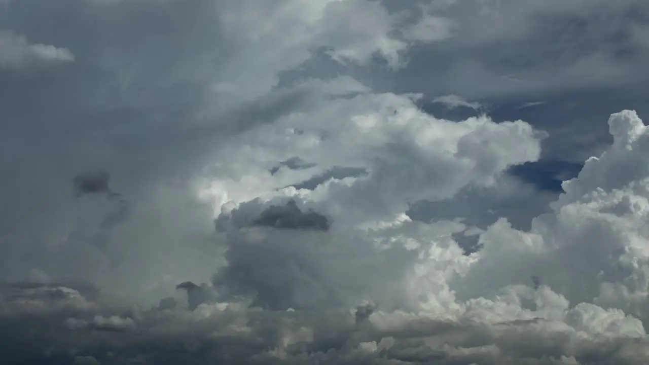 time lapse of tropical cumulus and cumulonimbus clouds moving from right to left as an tropical afternoon storm is building