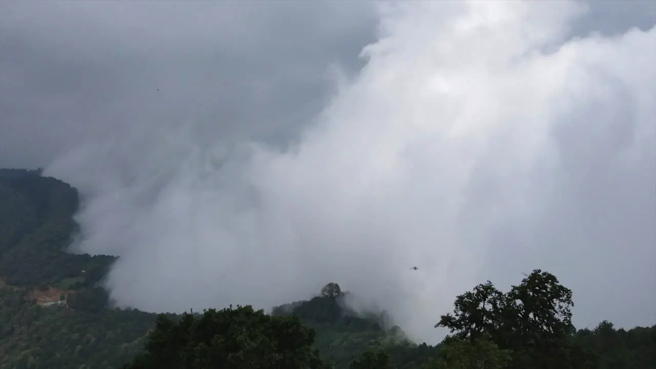 A time-lapse of clouds forming off the ridge of a mountain