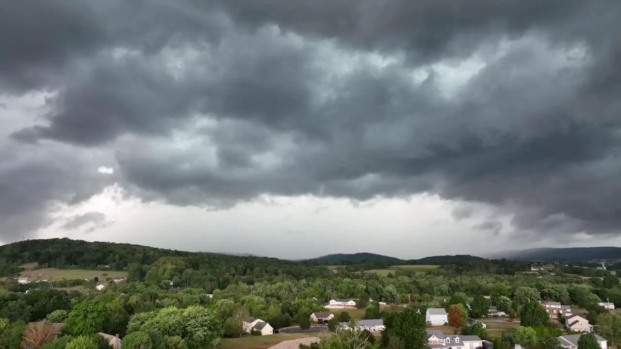 An aerial view of a large rainstorm moving over the countryside