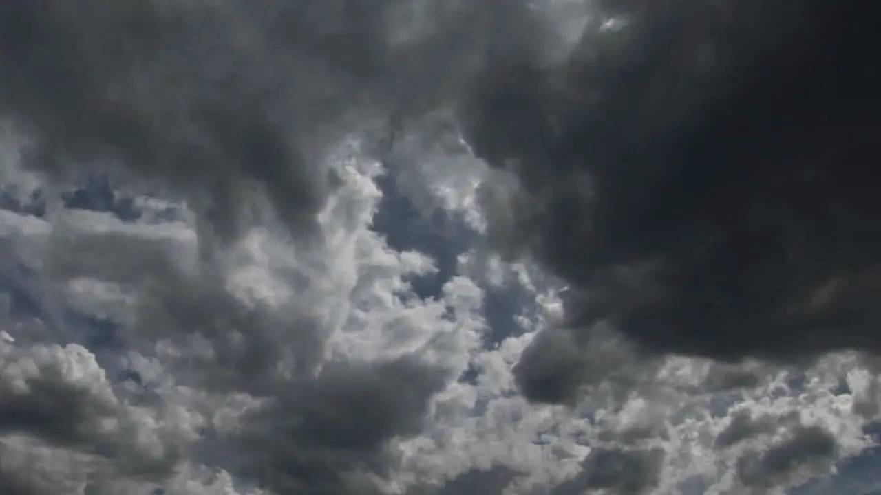 Storm clouds scuttle across the sky