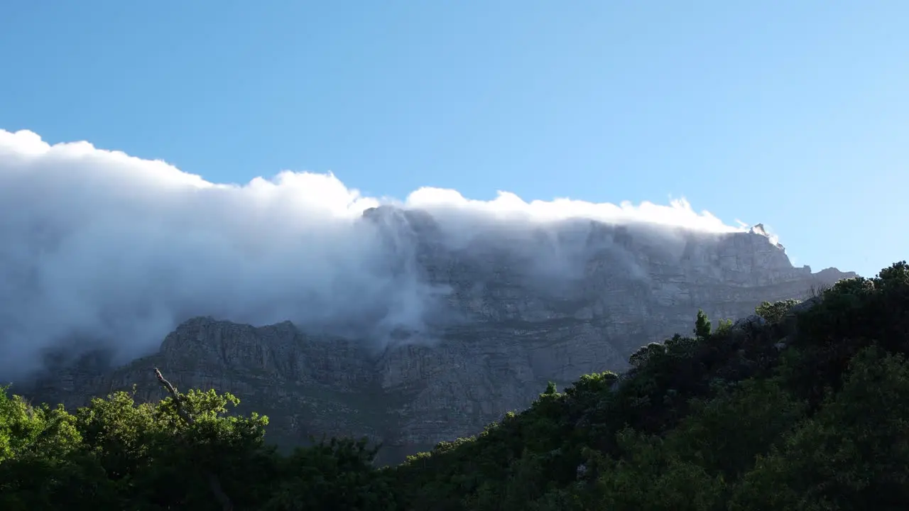 Clouds like waterfall over Table Mountain seen from Deer Park Wide