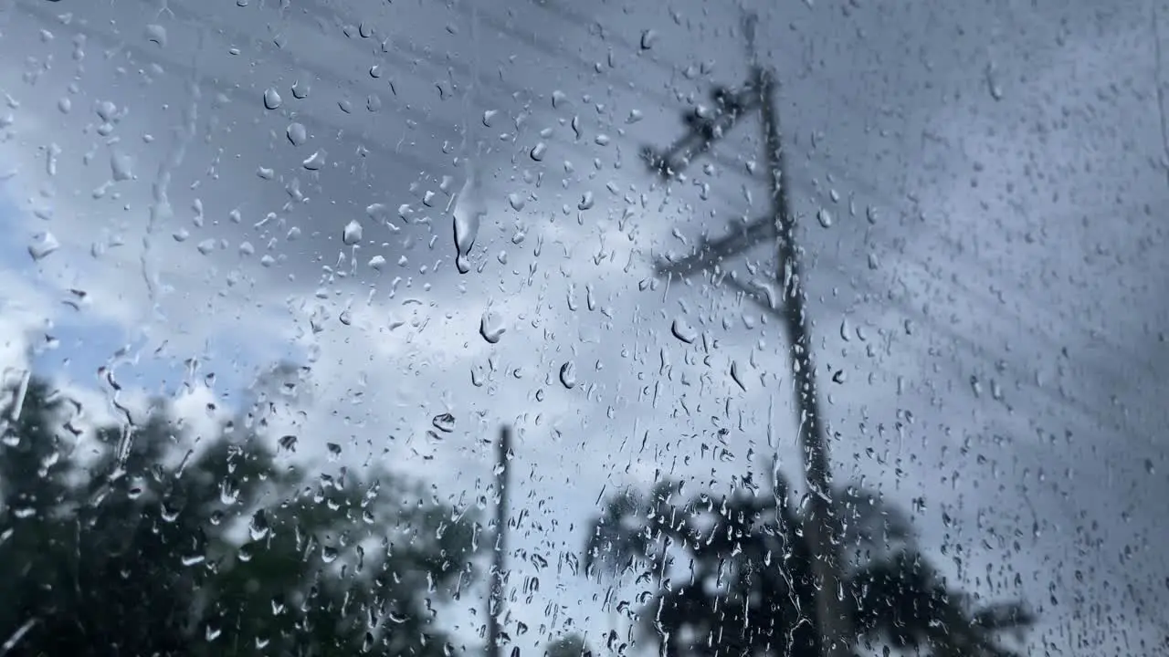 Storm brings rain in Bangladesh as seen from a glass window