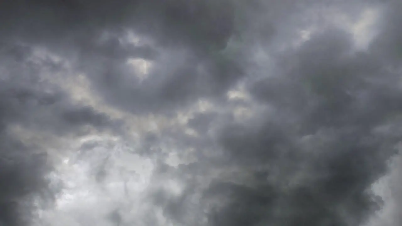 Storm lightning flashes above the night sky