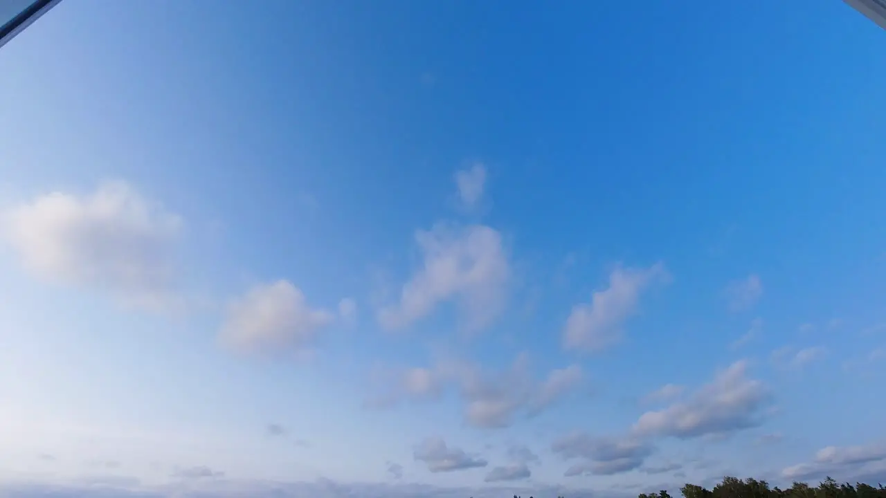 Time lapse of pink clouds rolling in the sky