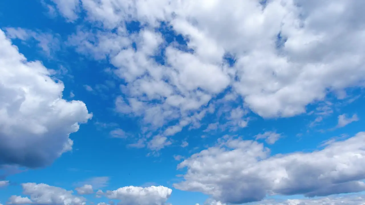 Time lapse of slow puffy clouds moving in the sky