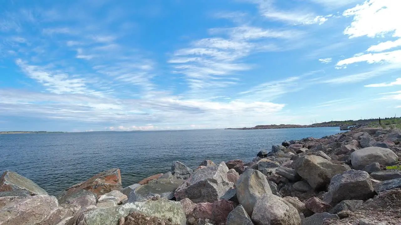 Time lapse of clouds rolling in the sky over a lake