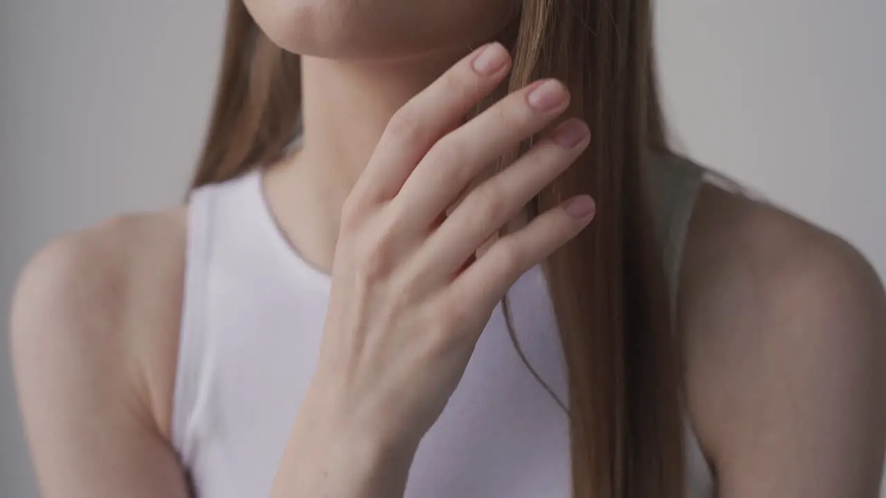 Detail Of A Girl Playing With Her Hair