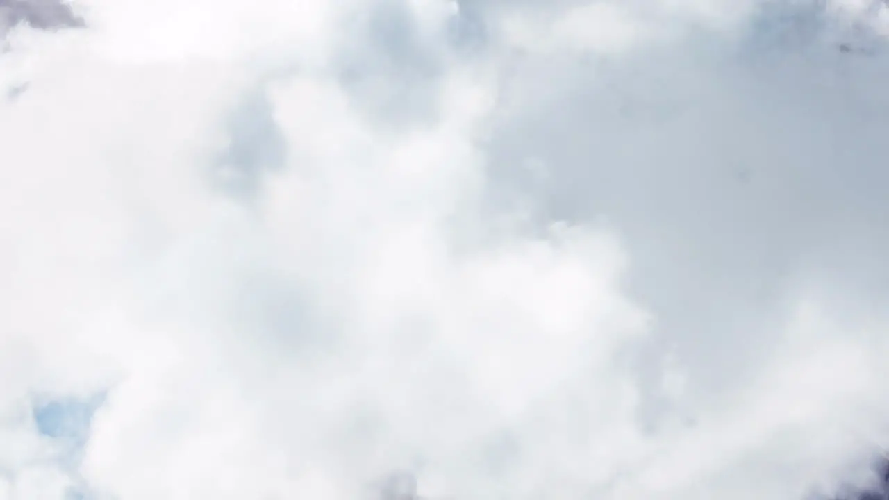 Animation of clouds moving over blue sky