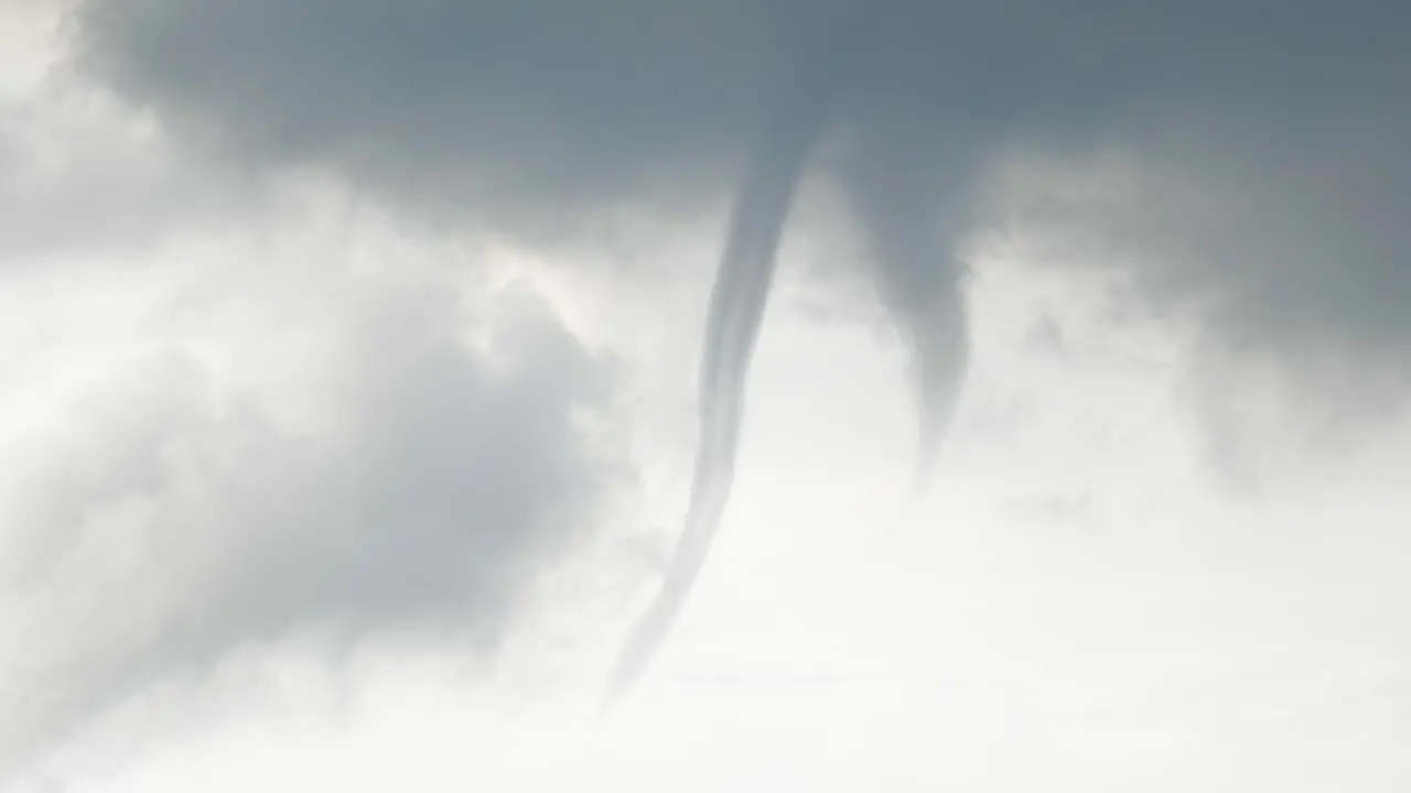 Waterspout funnel forming in the sky