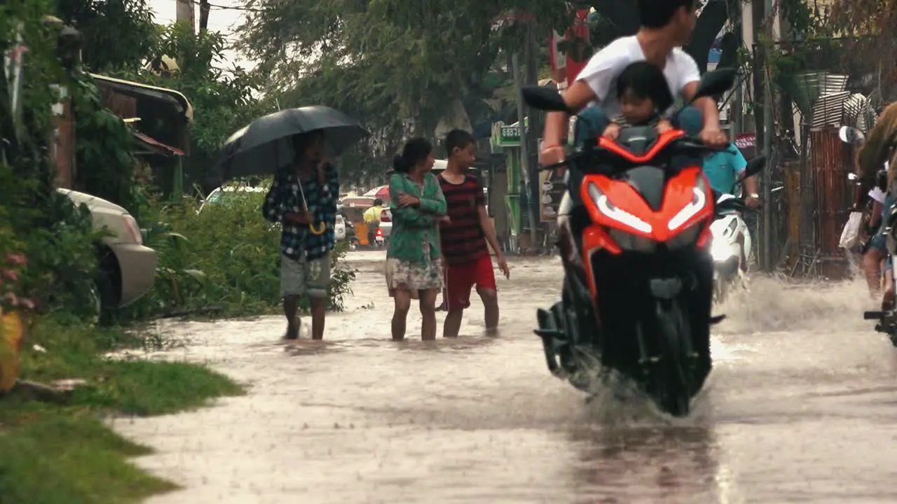 Traffic and Pedestrians Navigating the Flooded Streets of Siem Reap