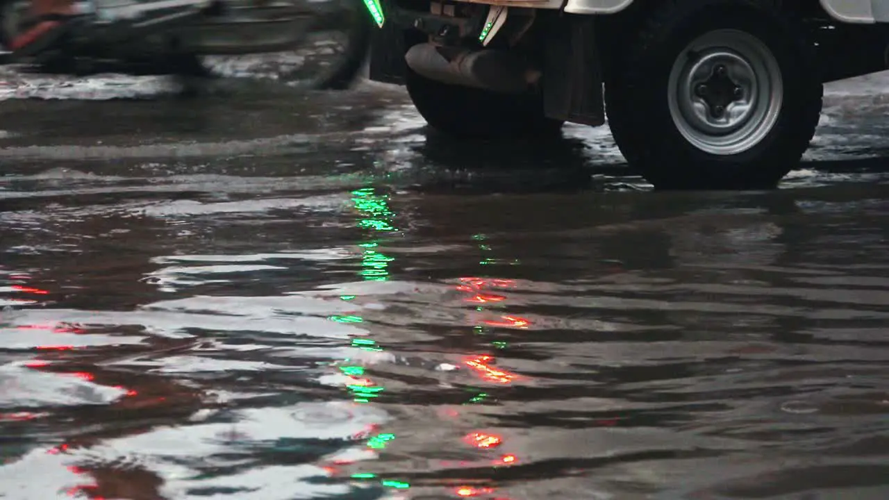 Traffic in Flooded Streets with Lights in the Reflections