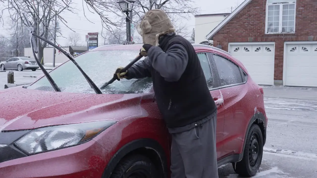 Scraping ice from the car