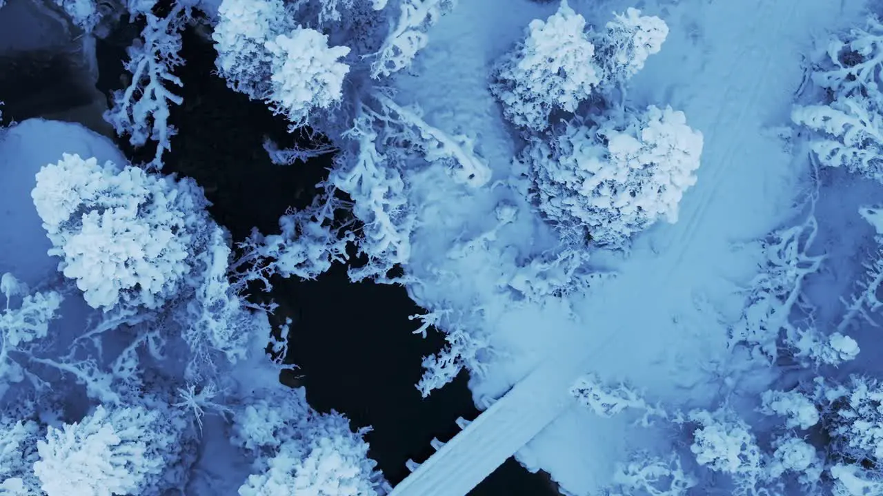 Above View Of Frigid Weather Over Frozen River And Forest During Winter In Norway