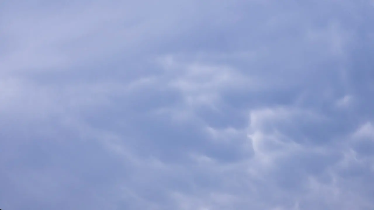 Moody blue grey mammatus clouds swirling overhead after a big storm time-lapse