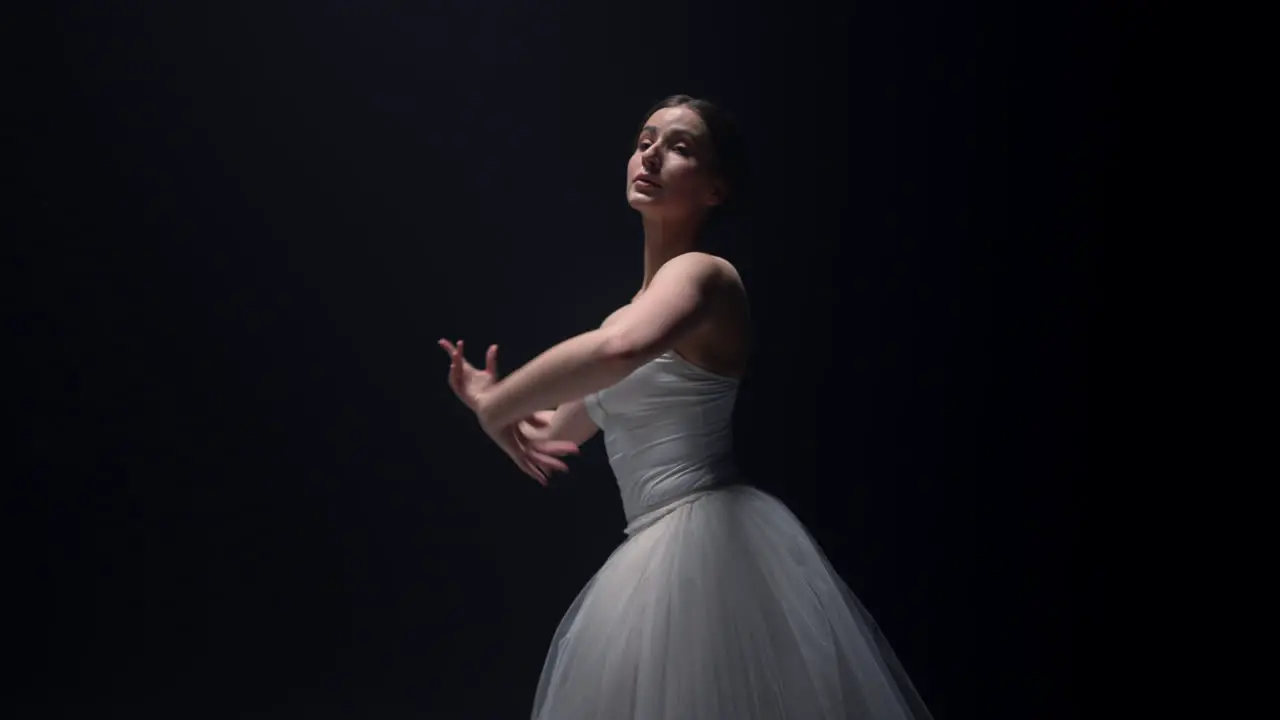 Beautiful ballet dancer spinning around in tutu skirt Ballerina dancing stage