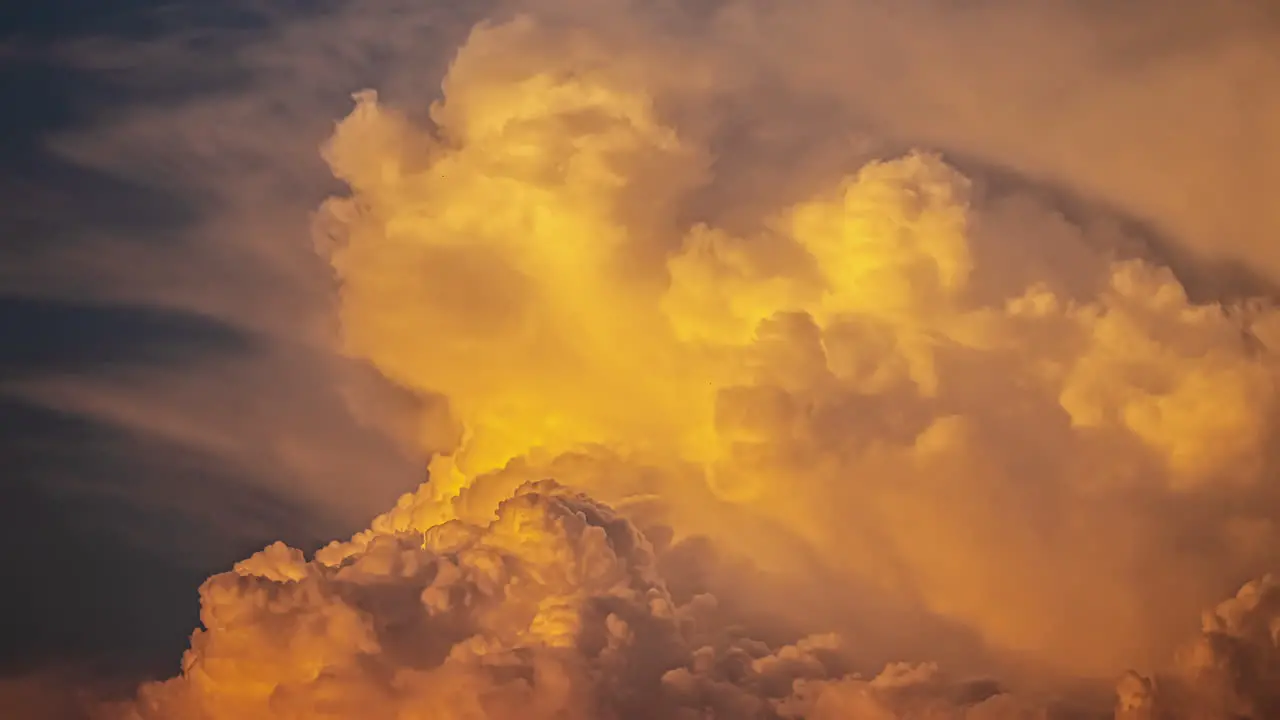 Storm clouds develop like an explosion in a darkening sky