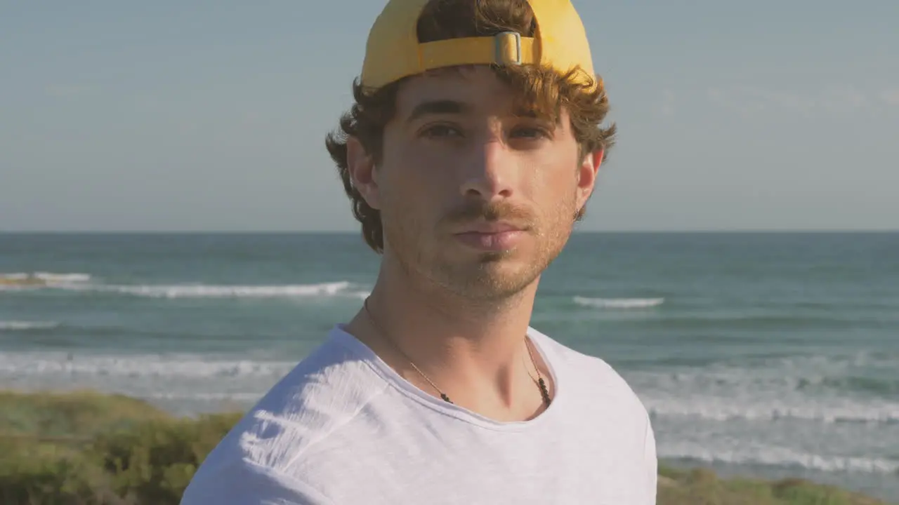 Portrait Of Athlete Man With Cap Looking At Camera