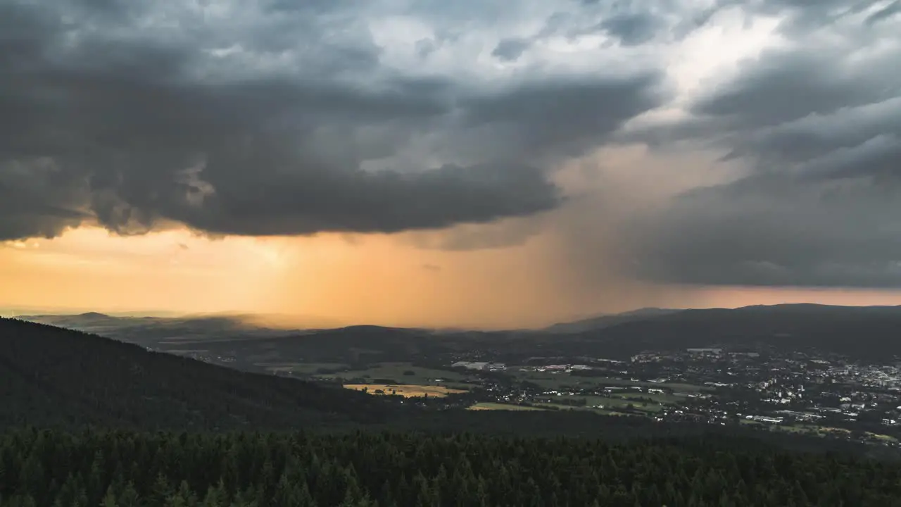 Timelapse of dark and orange storm clouds before sunset static view