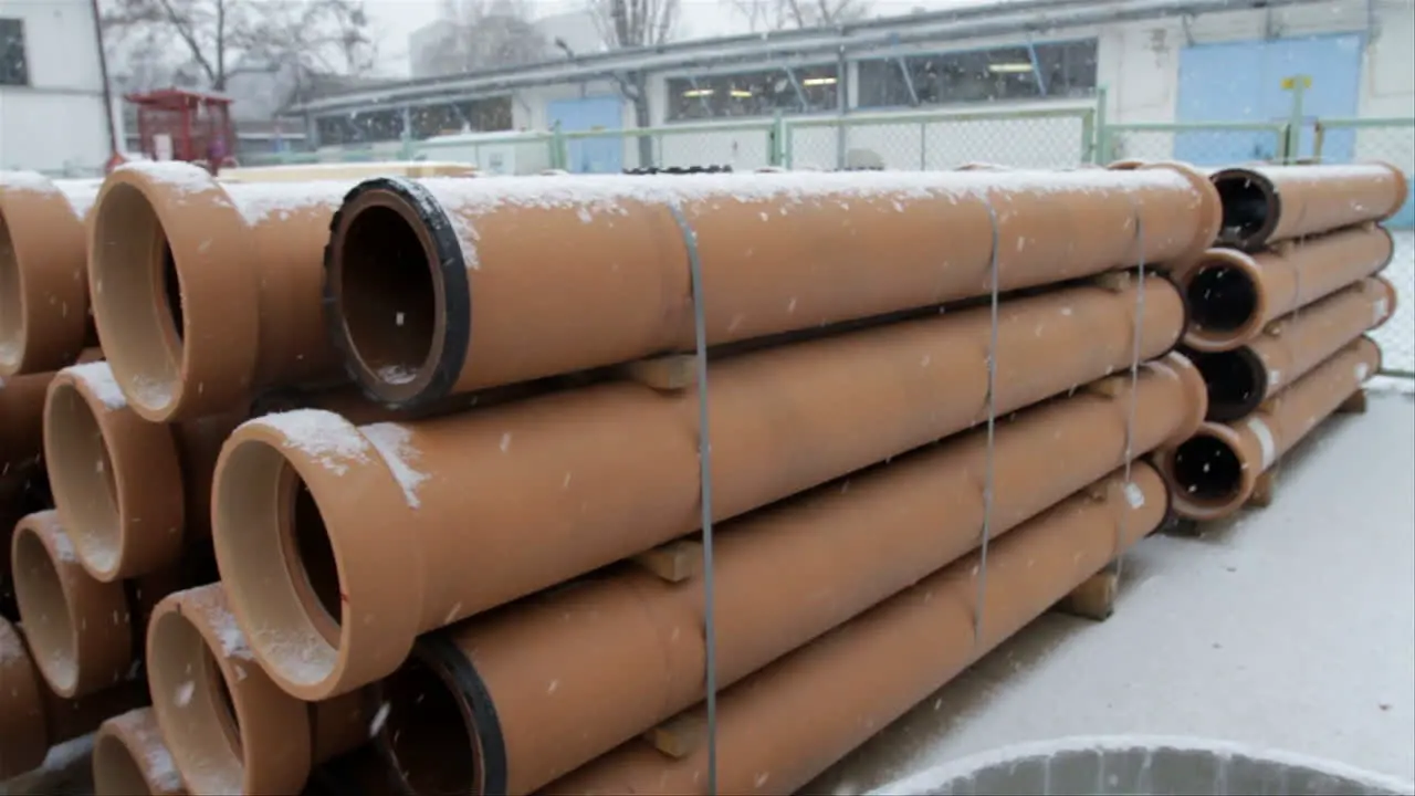 Heavy snow is falling in an open air storage area