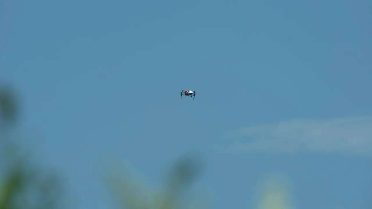 drone flying through blue skies and sunny weather