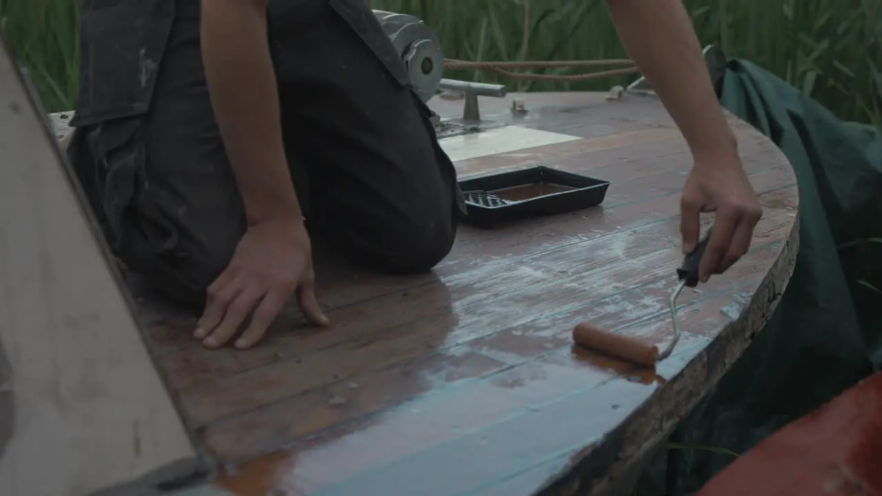 Rolling on varnish bow deck boat restoration