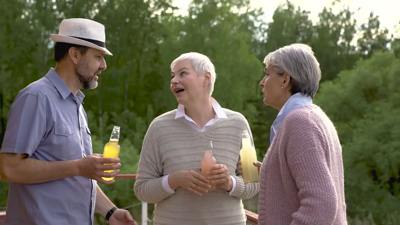 Group Of Senior People Dancing Talking And Having A Drink