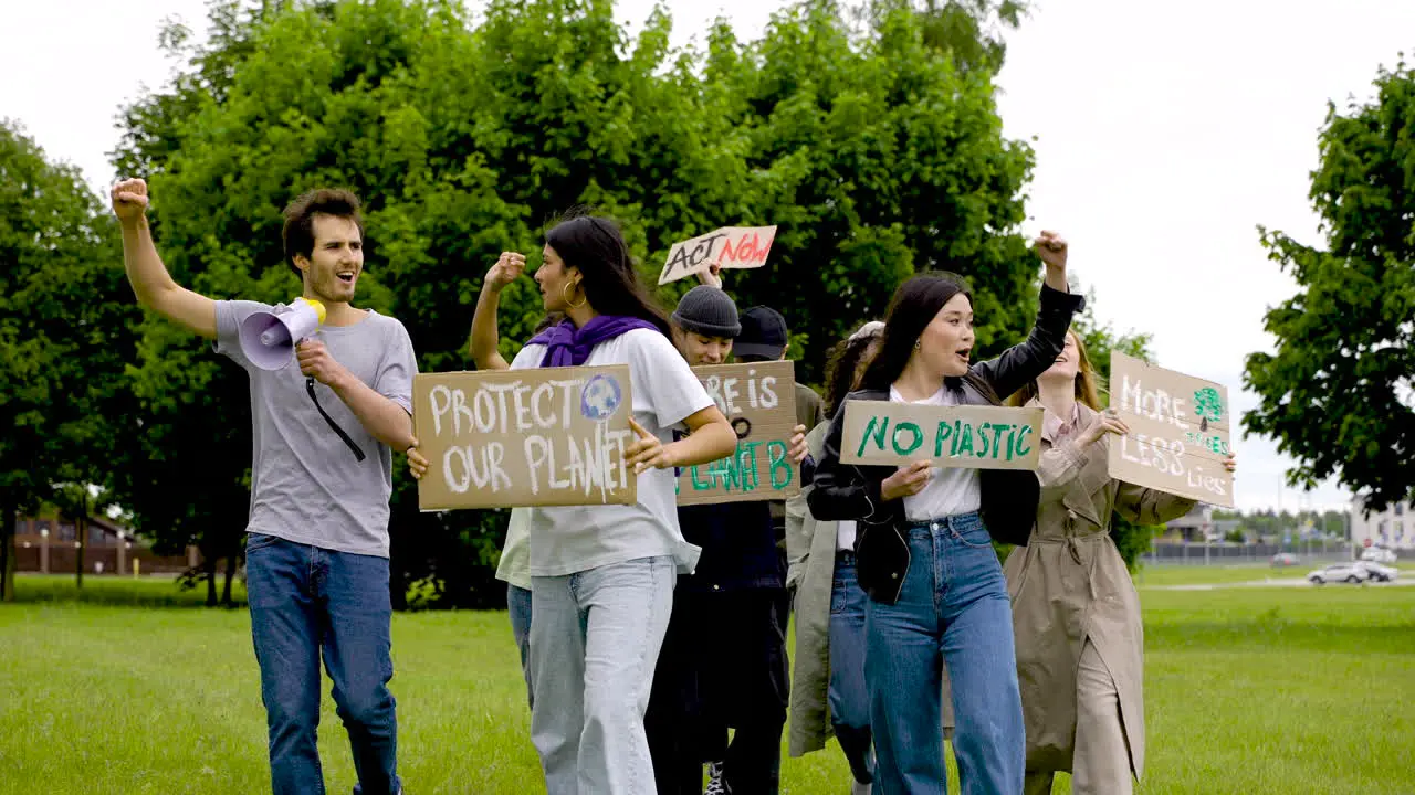 Group Of People In A Protest With Megaphones And Placards 6